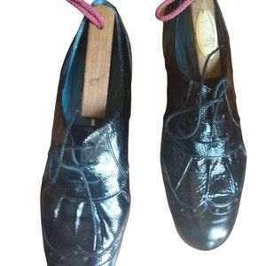 Biala black parent wingtip size 9